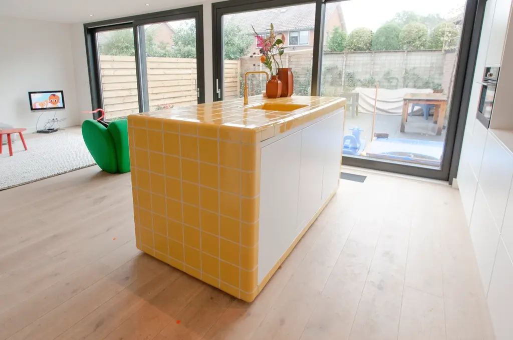 Bright room with a light floor and tiled kitchen island